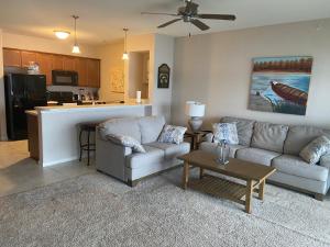 a living room with a couch and a table at Beautiful Lakeside Oasis in Rocky Mount