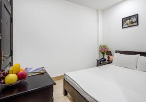 Llit o llits en una habitació de Lotus Rock Hotel Đà Nẵng