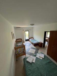 a room with a room with a bed and a table at Renome in Petrovac na Moru