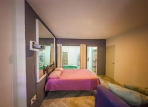 Ένα ή περισσότερα κρεβάτια σε δωμάτιο στο Estudio Aralias Relax & Go
