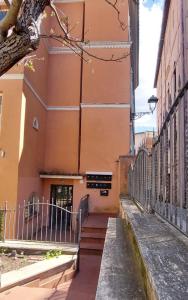 an alleyway leading to a building with stairs at Relax&Business Velletri Centro in Velletri
