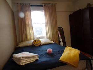 a bed with a pumpkin on top of it at Top Chiswick Apartments, London Center Area in London