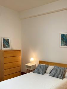 Postel nebo postele na pokoji v ubytování Lapilli Home