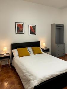 Postel nebo postele na pokoji v ubytování Lapilli Home
