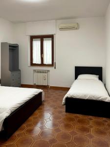 Postel nebo postele na pokoji v ubytování Lapilli Home