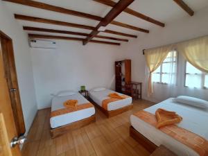 Voodi või voodid majutusasutuse HOSTAL TERO REAL toas