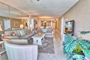 a living room with couches and a table at Bahia Vista 361- Club Bahia in St Petersburg