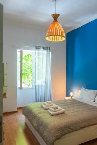 Postel nebo postele na pokoji v ubytování Bright and Cozy Apartment in the Center of Athens