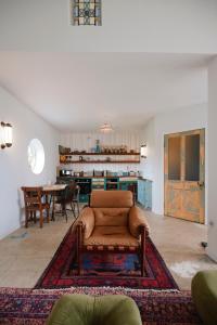a living room with a couch and a table at Molly's Cabin, Countryside Stay in Sutton Bonington +22 photos