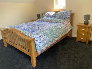 Un pat sau paturi într-o cameră la WHITEHILL STABLES