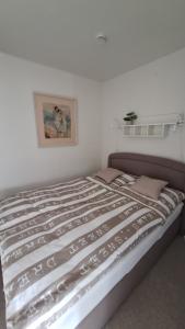 En eller flere senge i et værelse på Ferienwohnung Sophie