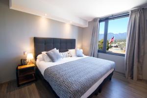 Rúm í herbergi á Hotel Enjoy Pucón