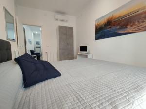 Postel nebo postele na pokoji v ubytování Bilocale per 2 - Quadrilocale per 6 - Appartamenti Sebastiani centralissimi
