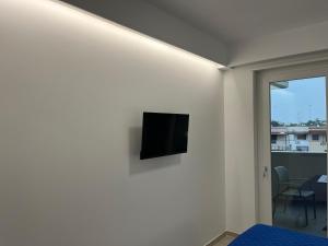 Un televizor și/sau centru de divertisment la Albachiara