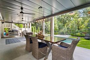 a dining room with a table and chairs at Piedmont Park Pool-Side Retreat in Atlanta