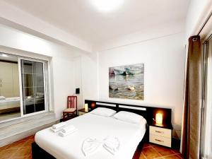 Postel nebo postele na pokoji v ubytování BrunAri Apartment