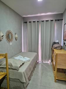 Ein Bett oder Betten in einem Zimmer der Unterkunft FLAT 104 Luis Correia Vila Atlântida