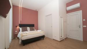 Voodi või voodid majutusasutuse Manere Suites toas