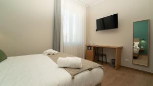 Voodi või voodid majutusasutuse Manere Suites toas