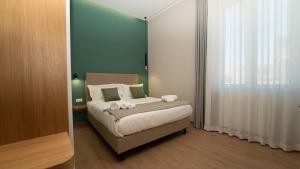 Voodi või voodid majutusasutuse Manere Suites toas