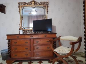 a dresser with a mirror and a television on top at B&B ANXUR in Terracina +29 photos