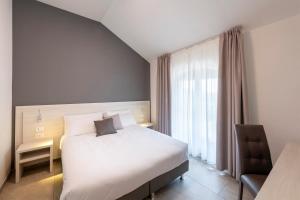 Postel nebo postele na pokoji v ubytování Hotel Vecchio Casello + 37 fotografií