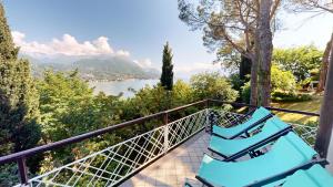 a balcony with chairs and a view of a lake at Villa Elvira in San Felice del Benaco
