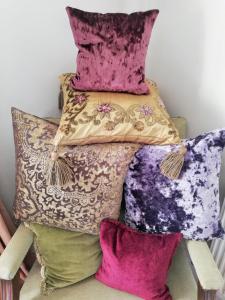 a stack of pillows on top of each other at Michaelmas Cottage Upavon in Upavon