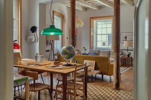 a living room with a table and a couch at Hotel Hevresac Singular & Small in Mahón