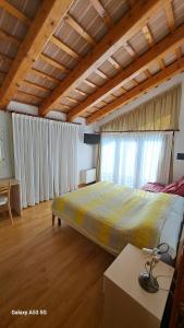a bedroom with a large bed in a room at Country House Bucaneve in Rovolon