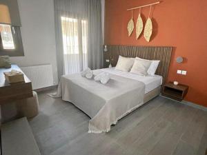 Postel nebo postele na pokoji v ubytování Αura Luxury Apartments