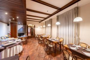 TV a/nebo společenská místnost v ubytování Hotel Vecchio Casello