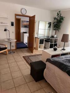 a living room with a couch and a table at Ferienwohnung am Nürburgring in Siebenbach