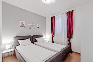 Postel nebo postele na pokoji v ubytování Vrbovica apartment + 23 fotografií