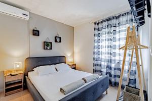 Postel nebo postele na pokoji v ubytování Vrbovica apartment