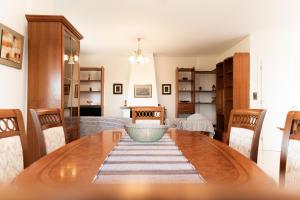 a dining room with a table and chairs at ArtView Villa in Syvota