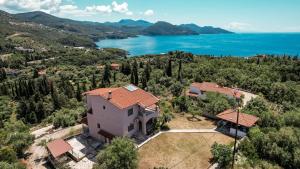 an aerial view of a house with a lake at ArtView Villa in Sivota