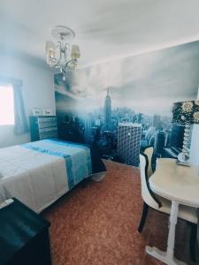 a bedroom with a bed and a view of a city at Casa rural Bodega Dorada in Cehegín +25 photos