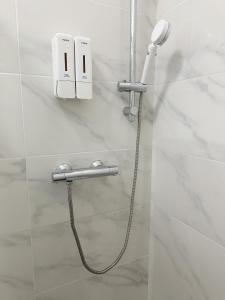 a shower in a bathroom with a shower head at Venice mestre sweet home in Marghera
