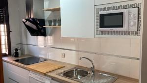 Kuchyň nebo kuchyňský kout v ubytování Apartamento Bellarhouse II