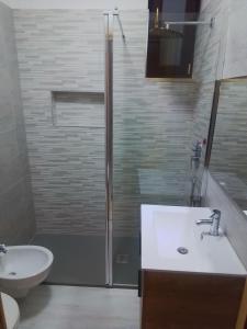 a bathroom with a sink and a shower at Casa Materdomini in Brindisi