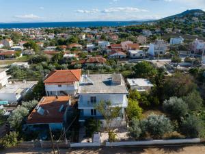 an aerial view of a city with houses at Anastasia's lemon garden in Artemida