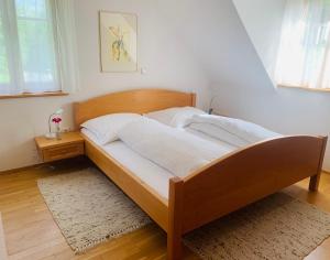 Postel nebo postele na pokoji v ubytování Apartments Grabenmühle