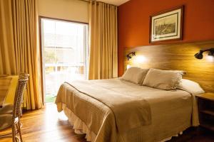 Ένα ή περισσότερα κρεβάτια σε δωμάτιο στο Pousada Kaliman Premium