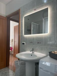 a bathroom with a sink and a mirror at NORA House in Savona +42 photos