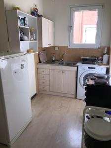 Kuchyň nebo kuchyňský kout v ubytování Ipsos apartment