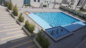an overhead view of a swimming pool in a building at Nouvel Horizon in Nabeul