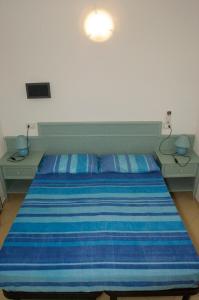 Posteľ alebo postele v izbe v ubytovaní Residence Blu Marlin Natural beach