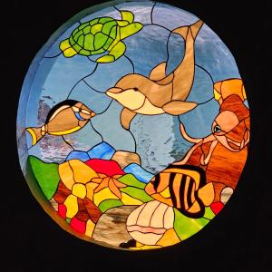 a stained glass window with fish and algae at Yarbarita's Stay and Play in Rockport
