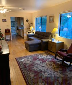 a living room with a couch and a rug at Mercury Villa - Room in Private Residence in Grass Valley